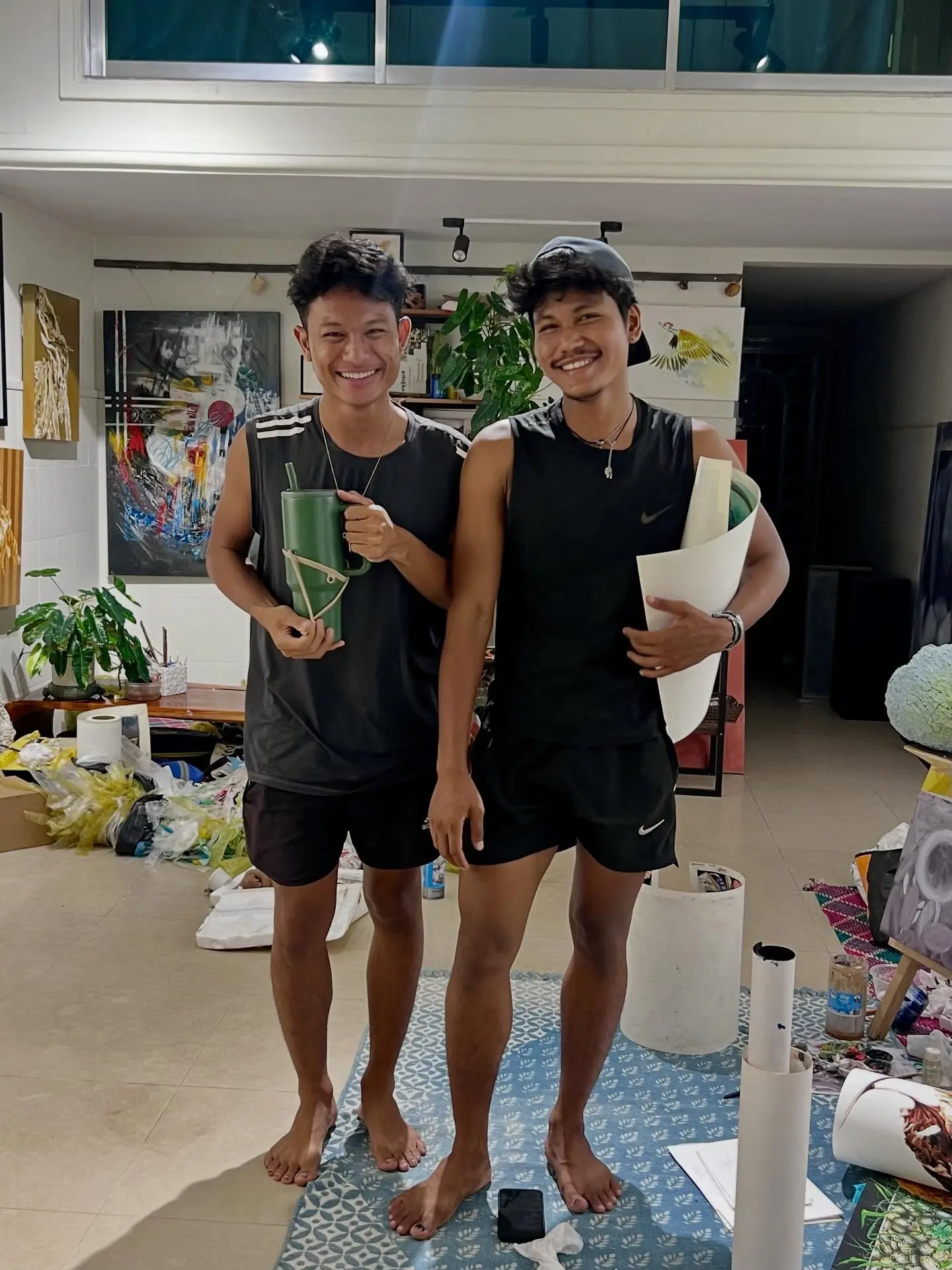 Karona and Zak Arts working in their art studio at SaKa Atelier, contemporary Khmer artists in Siem Reap Cambodia